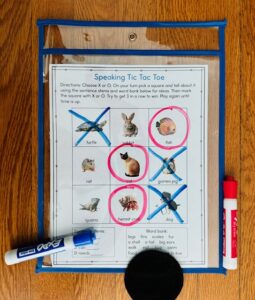 tic tac toe ESL speaking game using ESOL classroom supplies dry erase pocket sleeves and markers